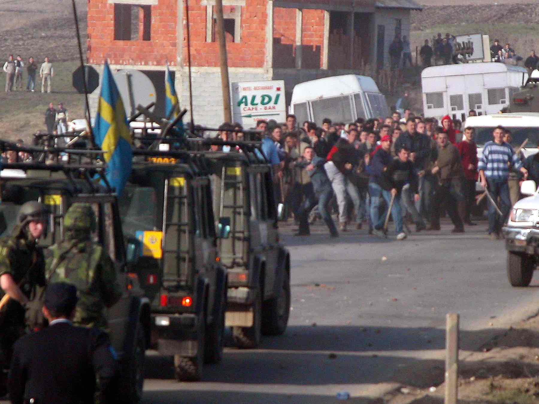 Swedish soldiers of the multinational NATO force in Kosovo known as KFOR try to re-establish order near the village of Caglavica