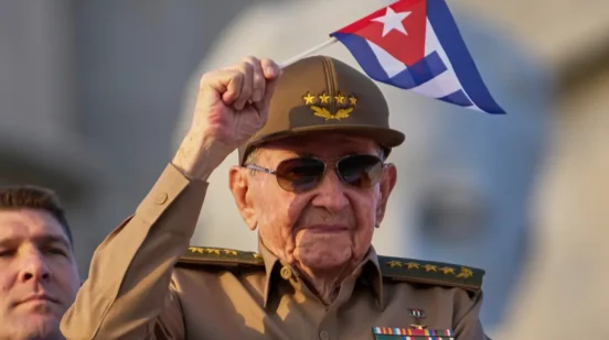 Raul Castro waves a Cuban flag