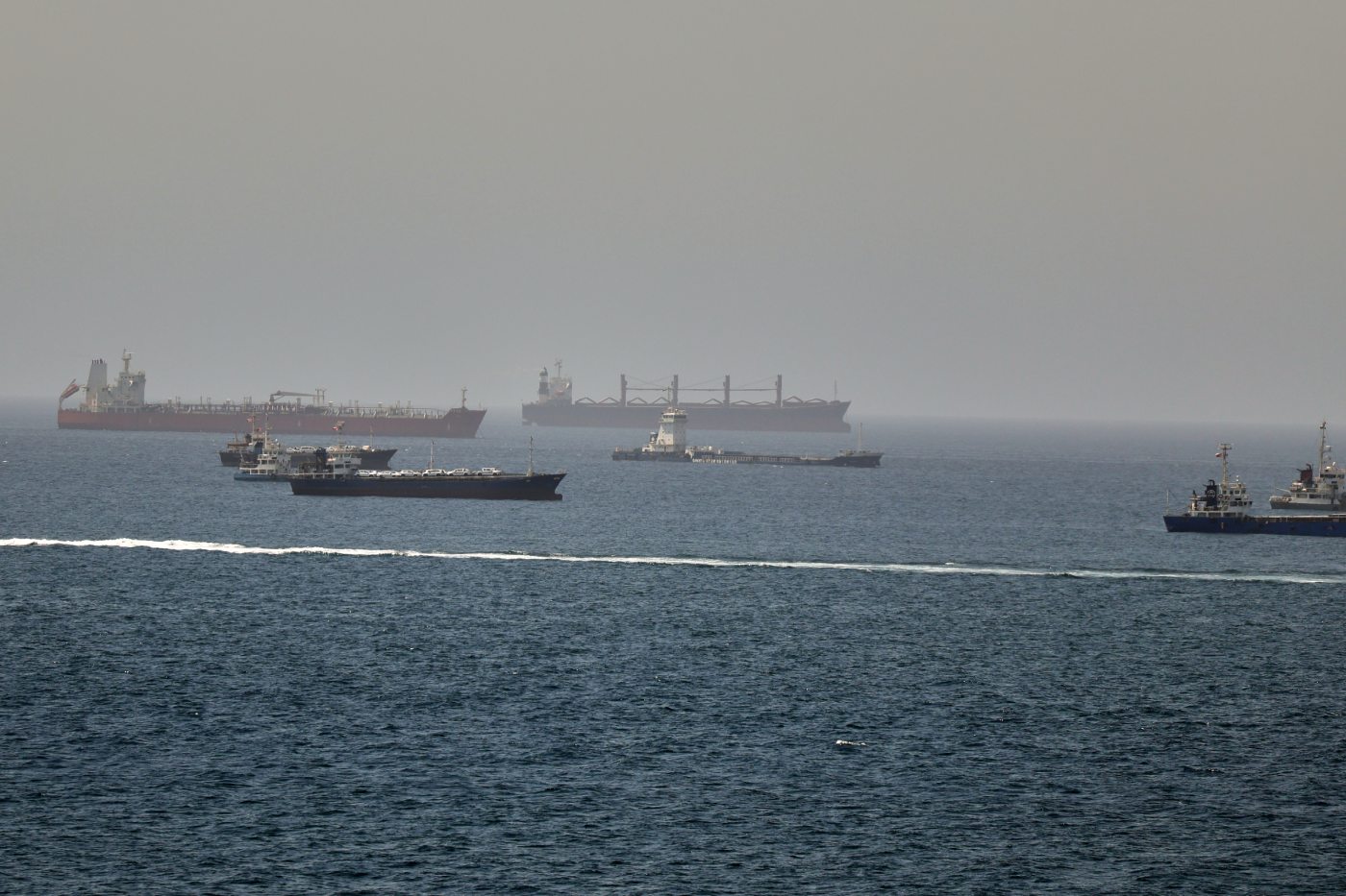 Tankers and cargo vessels are seen in the Gulf of Oman, along shipping routes linking the Strait of Hormuz and the Arabian Sea, Tuesday, June 16, 2026. (AP Photo)