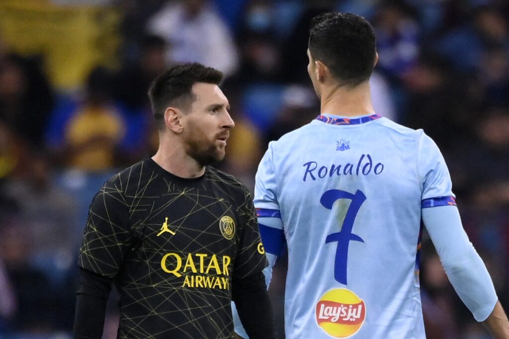 Paris Saint-Germain's Argentine forward Lionel Messi (L) walks past Riyadh All-Star's Portuguese forward Cristiano Ronaldo (R) during the Riyadh Season Cup football match between the Riyadh All-Stars and Paris Saint-Germain at the King Fahd Stadium in Riyadh on January 19, 2023.,Image: 750607524, License: Rights-managed, Restrictions: , Model Release: no , Credit line: FRANCK FIFE / AFP / Profimedia