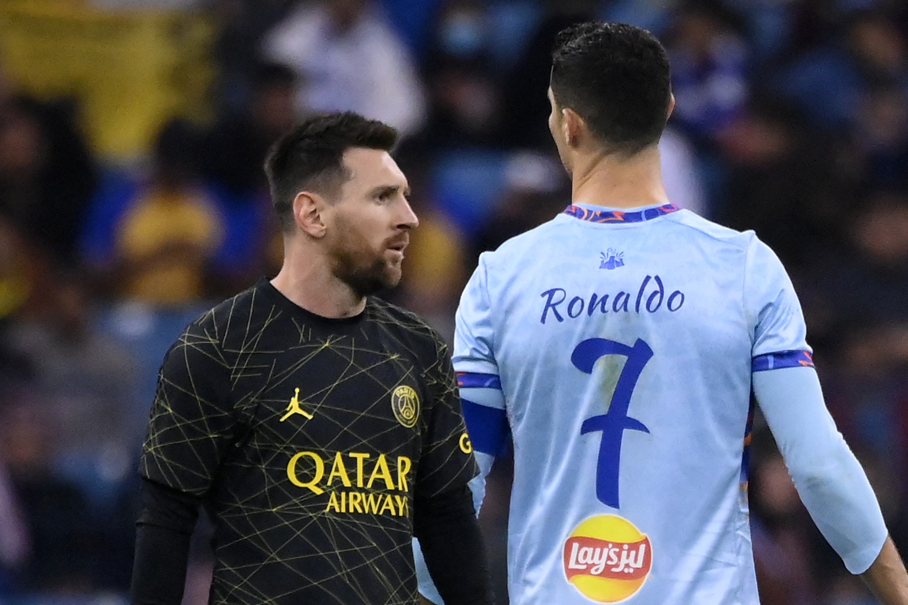 Paris Saint-Germain's Argentine forward Lionel Messi (L) walks past Riyadh All-Star's Portuguese forward Cristiano Ronaldo (R) during the Riyadh Season Cup football match between the Riyadh All-Stars and Paris Saint-Germain at the King Fahd Stadium in Riyadh on January 19, 2023.,Image: 750607524, License: Rights-managed, Restrictions: , Model Release: no , Credit line: FRANCK FIFE / AFP / Profimedia