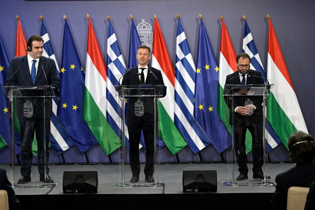 Hungarian Prime Minister Peter Magyar, centre, Hungarian Finance Minister Andras Karman, right, and President of the Eurogroup, Greek Finance Minister, Kyriakos Pierrakakis, hold a joint press conference at the Ministry of Finance in Budapest, Hungary, Friday, June 26, 2026. (Robert Hegedus/MTI via AP)
