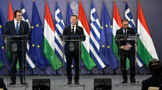 Hungarian Prime Minister Peter Magyar, centre, Hungarian Finance Minister Andras Karman, right, and President of the Eurogroup, Greek Finance Minister, Kyriakos Pierrakakis, hold a joint press conference at the Ministry of Finance in Budapest, Hungary, Friday, June 26, 2026. (Robert Hegedus/MTI via AP)