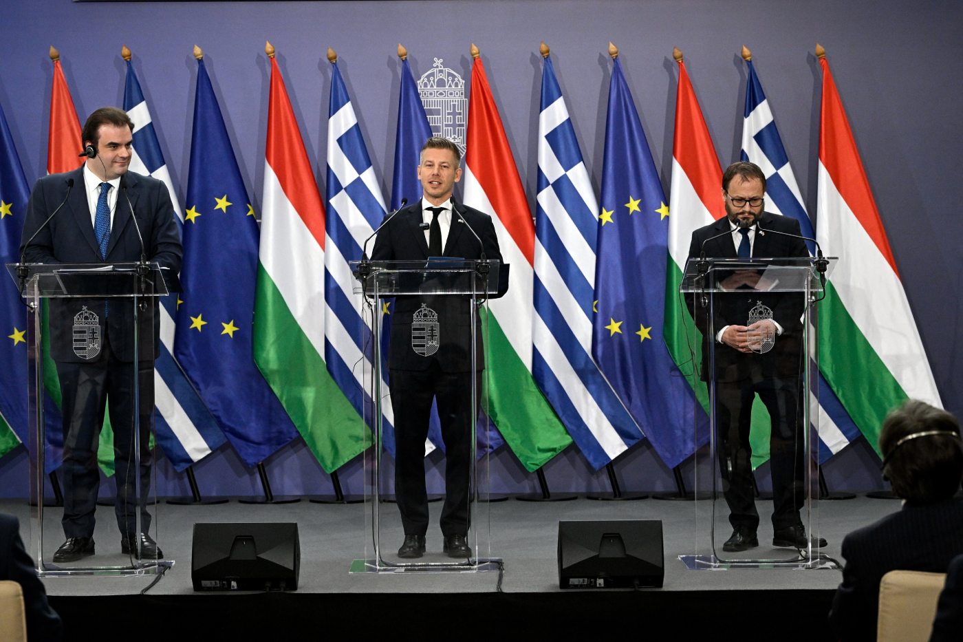 Hungarian Prime Minister Peter Magyar, centre, Hungarian Finance Minister Andras Karman, right, and President of the Eurogroup, Greek Finance Minister, Kyriakos Pierrakakis, hold a joint press conference at the Ministry of Finance in Budapest, Hungary, Friday, June 26, 2026. (Robert Hegedus/MTI via AP)