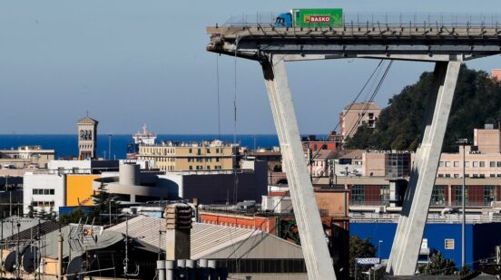FILE - A vehicle sits short of a section of the Morandi highway bridge that collapsed on Aug. 15, 2018, in Genoa, northern Italy. (AP Photo/Antonio Calanni, File)