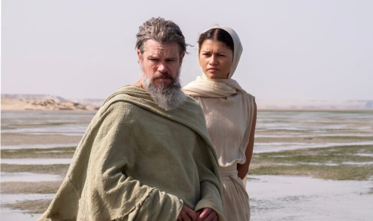 L to R: Matt Damon is Odysseus and Zendaya is Athena in THE ODYSSEY, written, produced, and directed by Christopher Nolan.
