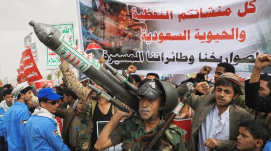 Houthi supporters hold a rally in Sanaa, Yemen, Friday, July 17, 2026, against the Saudi-led coalition. Banner in Arabic reads,
