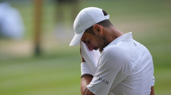Novak Đoković of Serbia wipes away sweat during his men's singles semifinal match against Jannik Sinner of Italy, at the Wimbledon Tennis Championships in London, Friday, July 10, 2026. (AP Photo/Kin Cheung)