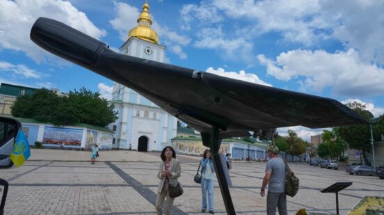 People look at a damaged Russian heavy drone installed as a symbol of war in central Kyiv, Ukraine, Friday, July 10, 2026. (AP Photo/Efrem Lukatsky)