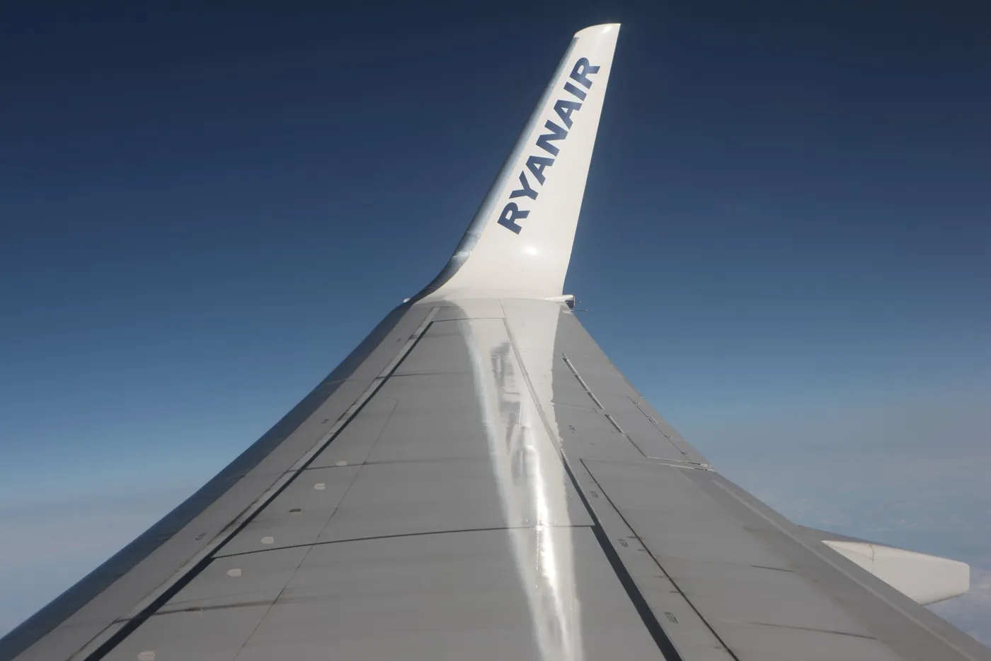 Ryanair name on aeroplane wing tip against blue sky background,Image: 34262637, License: Rights-managed, Restrictions: , Model Release: no , Credit line: Lynne Sutherland / Alamy / Profimedia
