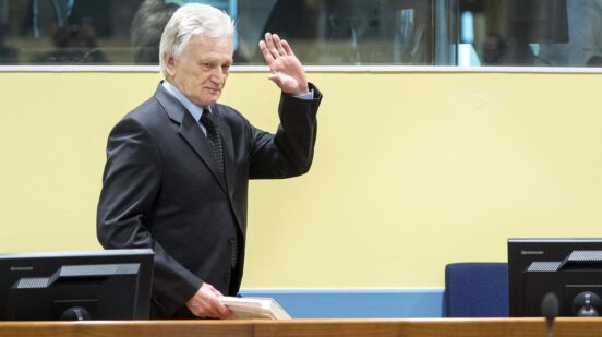 The former chief-of-staff of the Yugoslav Army, Momcilo Perisic, waves on February 28, 2013 as he arrives for his appeal judgement in a courtroom of the Yugoslav War Crimes Tribunal (ICTY) in The Hague. The UN war crimes court sentenced Perisic to 27 years in jail on Sepember 6, 2011 for helping the Bosnian Serb army murder and persecute Bosnian Muslims, including at Srebrenica in 1995.,Image: 154722694, License: Rights-managed, Restrictions: , Model Release: no , Credit line: Koen van Weel / AFP / Profimedia