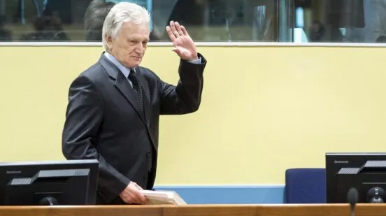 The former chief-of-staff of the Yugoslav Army, Momcilo Perisic, waves on February 28, 2013 as he arrives for his appeal judgement in a courtroom of the Yugoslav War Crimes Tribunal (ICTY) in The Hague. The UN war crimes court sentenced Perisic to 27 years in jail on Sepember 6, 2011 for helping the Bosnian Serb army murder and persecute Bosnian Muslims, including at Srebrenica in 1995.,Image: 154722694, License: Rights-managed, Restrictions: , Model Release: no , Credit line: Koen van Weel / AFP / Profimedia