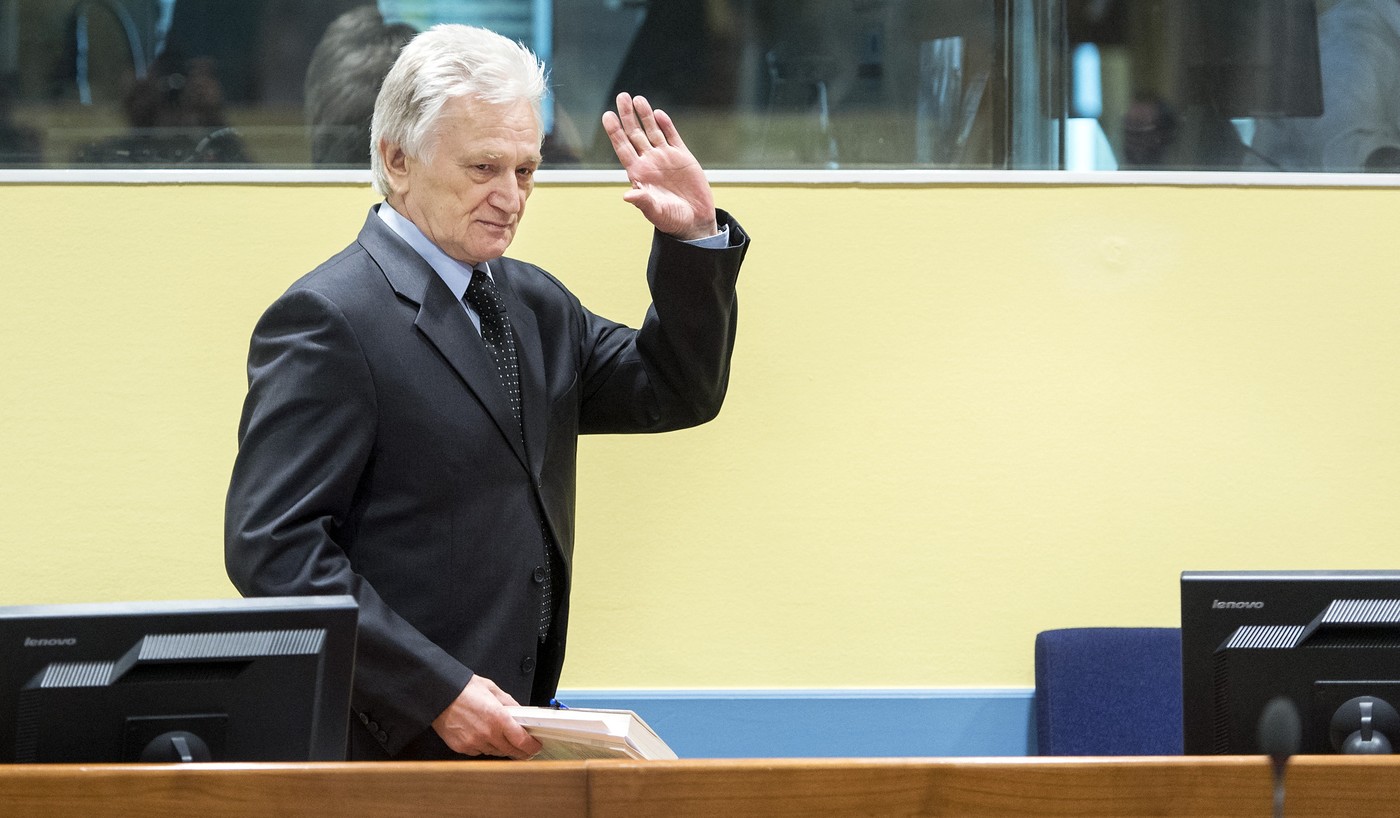 The former chief-of-staff of the Yugoslav Army, Momcilo Perisic, waves on February 28, 2013 as he arrives for his appeal judgement in a courtroom of the Yugoslav War Crimes Tribunal (ICTY) in The Hague. The UN war crimes court sentenced Perisic to 27 years in jail on Sepember 6, 2011 for helping the Bosnian Serb army murder and persecute Bosnian Muslims, including at Srebrenica in 1995.,Image: 154722694, License: Rights-managed, Restrictions: , Model Release: no , Credit line: Koen van Weel / AFP / Profimedia