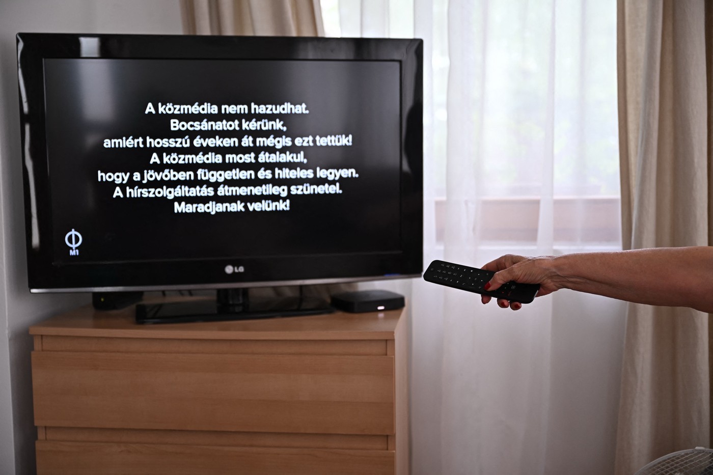 A message can be read on a tv screen at a family home in Agard, Hungary on July 7, 2026, as the main state channel, the M1 informs viewers of the temporary suspension of news broadcasts in all state broadcasters. Message reads - 'The public state media cannot lie. We apologize for doing this for so many years! The public media is now transforming itself to be independent and credible in the future. News service is temporarily suspended! Stay tuned!). Two Hungarian public broadcasters close to Viktor Orban have halted broadcasting as part of efforts to undo the longtime nationalist leader's hold on the media, Prime Minister Peter Magyar said on July 7, 2026. 