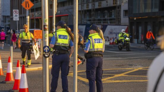 Police officers monitor urban road traffic at dusk, cones in the foreground, Dublin, Ireland,Image: 1116419804, License: Rights-managed, Restrictions: , Model Release: no , Credit line: Manuel Kamuf / imageBROKER / Profimedia