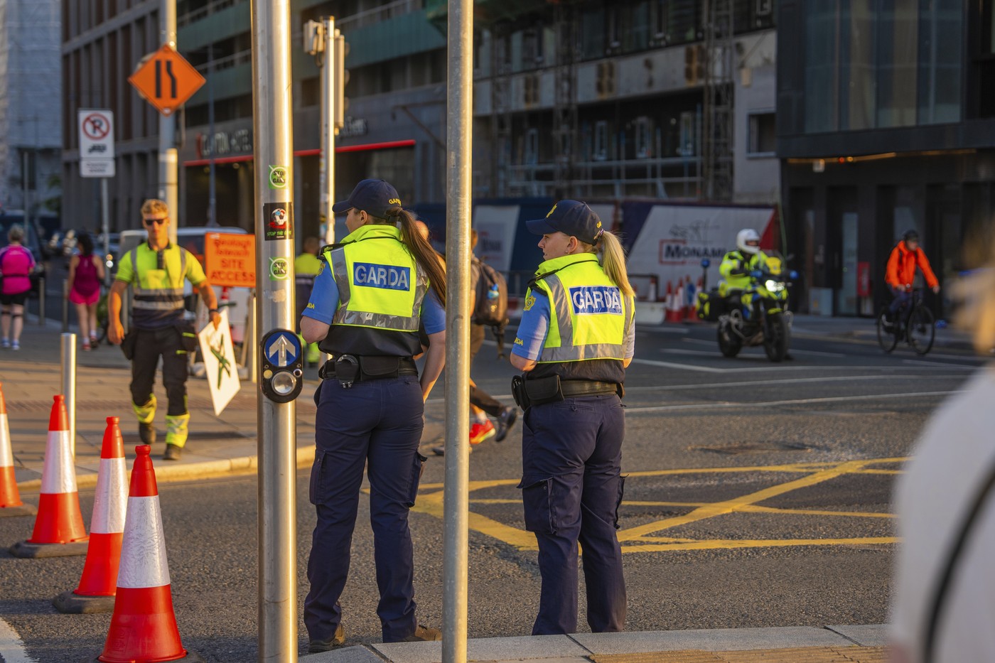 Police officers monitor urban road traffic at dusk, cones in the foreground, Dublin, Ireland,Image: 1116419804, License: Rights-managed, Restrictions: , Model Release: no , Credit line: Manuel Kamuf / imageBROKER / Profimedia